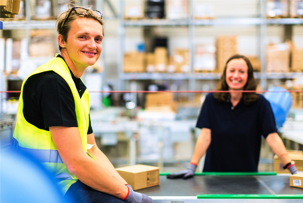 Smiling postal service employees